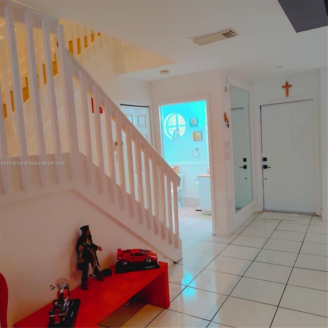 7486 SW 162nd Ct, Miami, FL 33193 - entryway with stairs and light tile patterned flooring