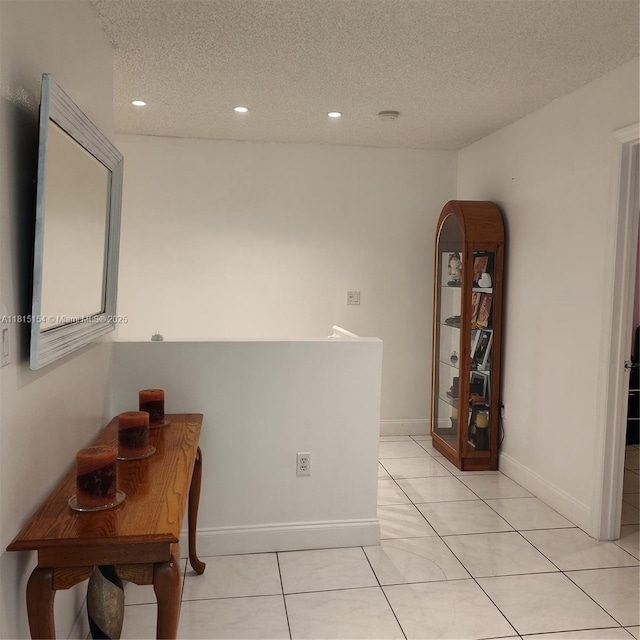 7486 SW 162nd Ct, Miami, FL 33193 - hallway with a textured ceiling, recessed lighting, light tile patterned floors, and baseboards