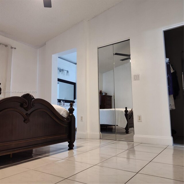 7486 SW 162nd Ct, Miami, FL 33193 - bedroom with a closet, baseboards, and light tile patterned flooring