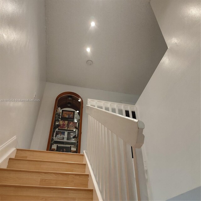 7486 SW 162nd Ct, Miami, FL 33193 - stairs featuring vaulted ceiling