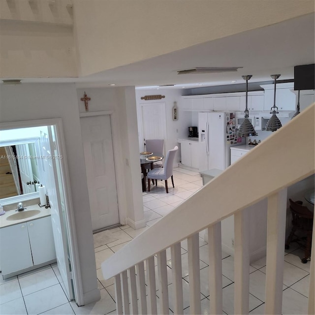 7486 SW 162nd Ct, Miami, FL 33193 - staircase featuring tile patterned floors and washer / clothes dryer