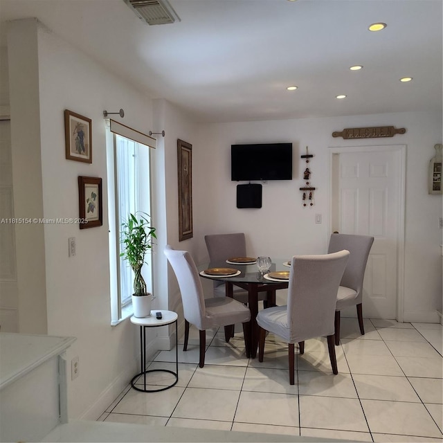 7486 SW 162nd Ct, Miami, FL 33193 - dining area with healthy amount of natural light, recessed lighting, light tile patterned flooring, and baseboards