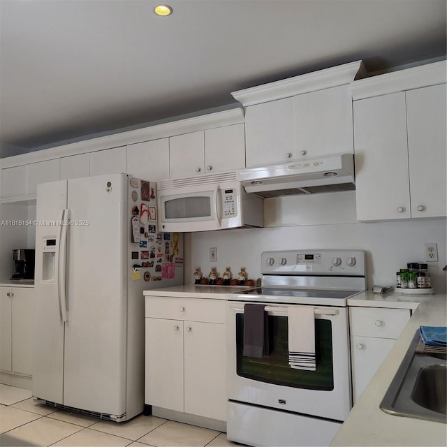 7486 SW 162nd Ct, Miami, FL 33193 - kitchen with white appliances, under cabinet range hood, light countertops, and white cabinetry