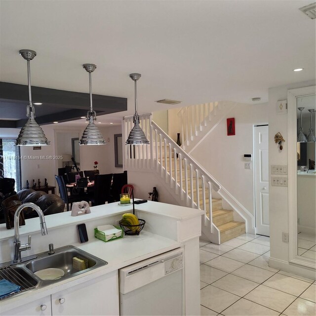 7486 SW 162nd Ct, Miami, FL 33193 - kitchen with white dishwasher, a sink, light countertops, light tile patterned flooring, and decorative light fixtures