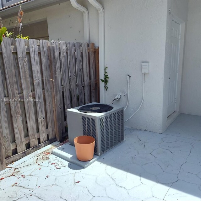 7486 SW 162nd Ct, Miami, FL 33193 - exterior view of cooling unit and stucco siding