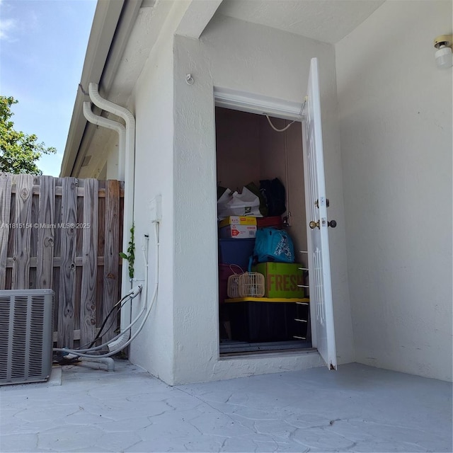 7486 SW 162nd Ct, Miami, FL 33193 - doorway to property with central air condition unit and stucco siding