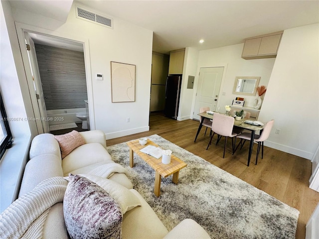 1619 Jefferson Ave Unit 19, Miami Beach, FL 33139 - living area with baseboards, wood finished floors, and recessed lighting