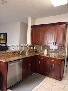16362 SW 23rd St, Miramar, FL 33027 - kitchen with stainless steel dishwasher, a peninsula, light tile patterned flooring, backsplash, and stone counters