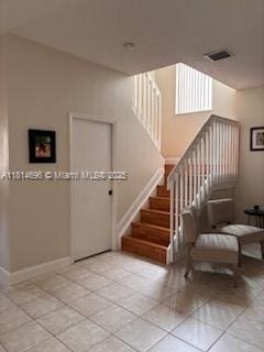 16362 SW 23rd St, Miramar, FL 33027 - stairs featuring tile patterned floors and baseboards