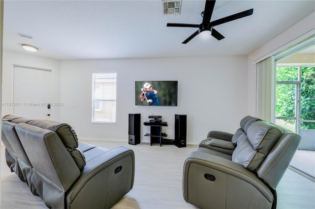 9722 SW Glenbrook Dr, Port St Lucie, FL 34987 - living area featuring ceiling fan, baseboards, plenty of natural light, and light wood finished floors