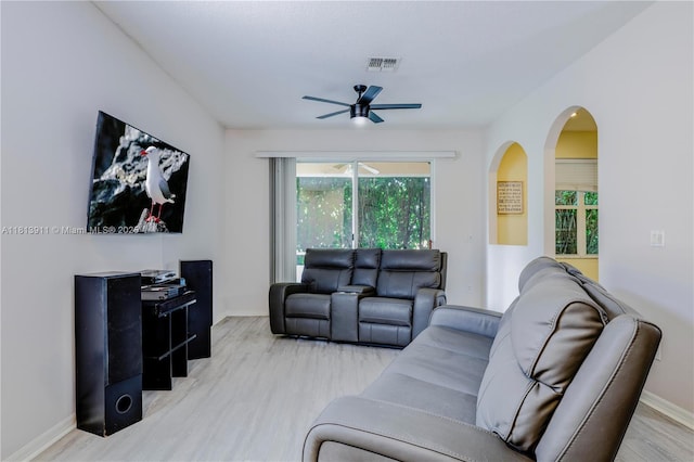 9722 SW Glenbrook Dr, Port St Lucie, FL 34987 - living area featuring ceiling fan, wood finished floors, baseboards, and arched walkways