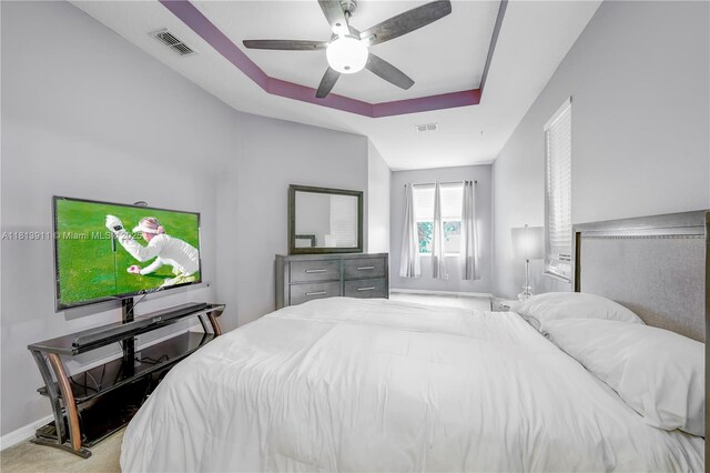 9722 SW Glenbrook Dr, Port St Lucie, FL 34987 - bedroom with a tray ceiling, a ceiling fan, and baseboards