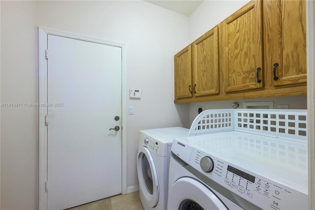 9722 SW Glenbrook Dr, Port St Lucie, FL 34987 - laundry area featuring washer and dryer, cabinet space, and light tile patterned flooring