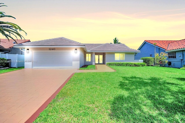 1240 NW 161st Ave, Pembroke Pines, FL 33028 - ranch-style home with an attached garage, concrete driveway, a tile roof, and stucco siding
