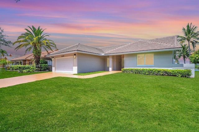 1240 NW 161st Ave, Pembroke Pines, FL 33028 - ranch-style home with driveway, a tile roof, a front yard, a garage, and stucco siding