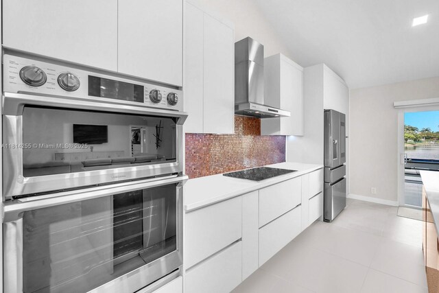 1240 NW 161st Ave, Pembroke Pines, FL 33028 - kitchen with appliances with stainless steel finishes, wall chimney exhaust hood, modern cabinets, tasteful backsplash, and white cabinets