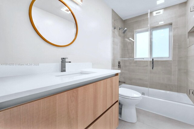 1240 NW 161st Ave, Pembroke Pines, FL 33028 - full bathroom with toilet, vanity, tile patterned floors, and shower / bath combination with glass door