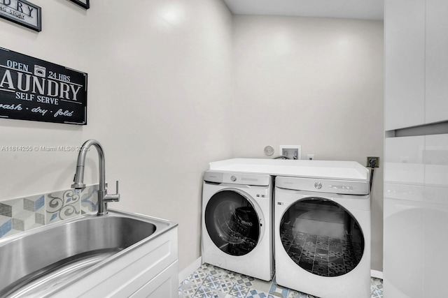 1240 NW 161st Ave, Pembroke Pines, FL 33028 - laundry room featuring washing machine and clothes dryer, cabinet space, and baseboards