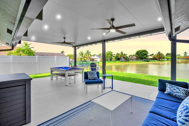 1240 NW 161st Ave, Pembroke Pines, FL 33028 - patio terrace at dusk with a patio area, a ceiling fan, a water view, and outdoor lounge area