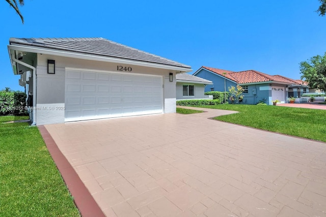 1240 NW 161st Ave, Pembroke Pines, FL 33028 - view of front of property featuring driveway, a front lawn, an attached garage, stucco siding, and a tiled roof
