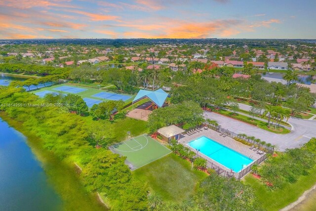 1240 NW 161st Ave, Pembroke Pines, FL 33028 - aerial view at dusk of view of pool area, a water view, and a residential view