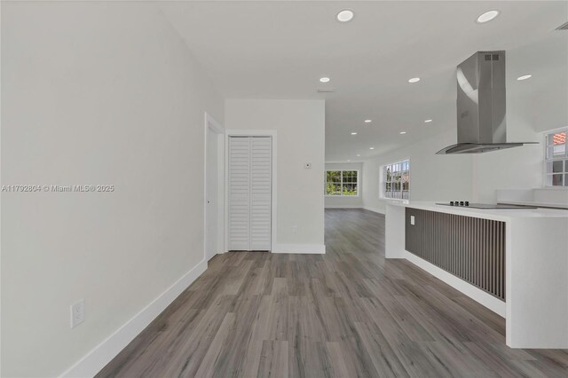 2357 SW 11th Ter, Miami, FL 33135 - unfurnished living room featuring recessed lighting, wood finished floors, and baseboards