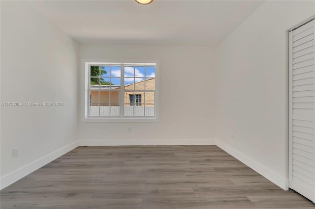 2357 SW 11th Ter, Miami, FL 33135 - spare room with baseboards and wood finished floors