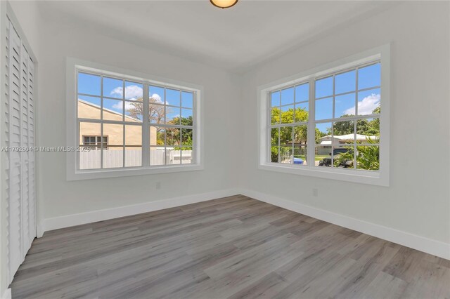 2357 SW 11th Ter, Miami, FL 33135 - unfurnished room with baseboards and wood finished floors