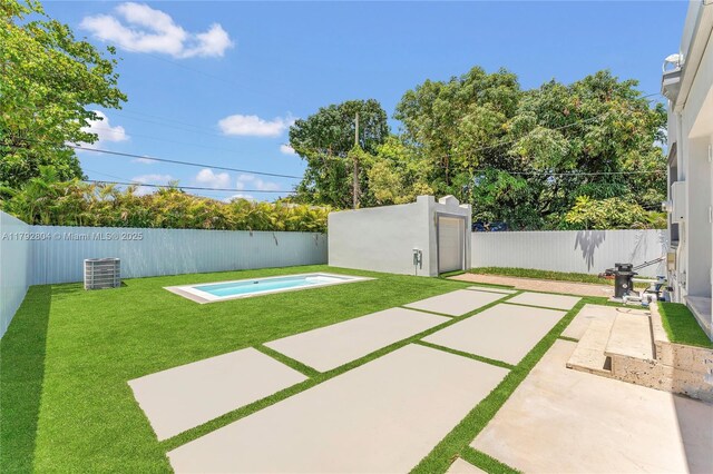 2357 SW 11th Ter, Miami, FL 33135 - view of yard with a patio area and central AC