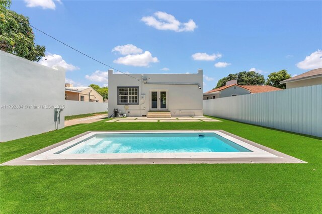 2357 SW 11th Ter, Miami, FL 33135 - rear view of property featuring entry steps, french doors, and stucco siding