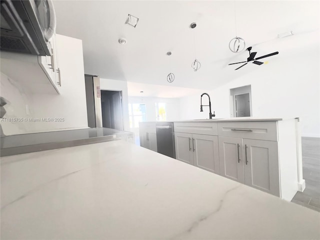 8036 104th Ct, Vero Beach, FL 32967 - kitchen featuring dishwasher, a ceiling fan, pendant lighting, light countertops, and wood finished floors