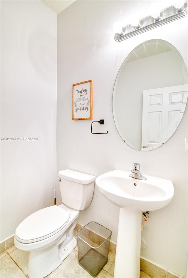 6489 N Anise Ct, Davie, FL 33314 - half bathroom featuring toilet and tile patterned floors