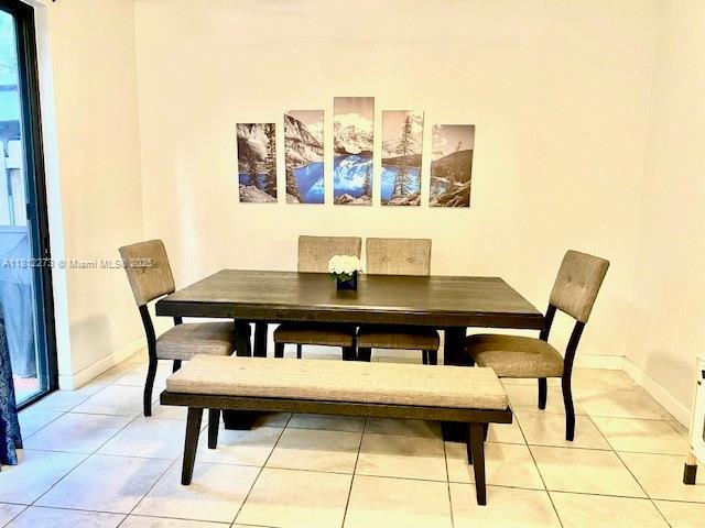 6489 N Anise Ct, Davie, FL 33314 - dining room with light tile patterned flooring and baseboards