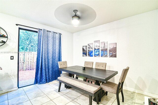 6489 N Anise Ct, Davie, FL 33314 - dining area with ceiling fan, light tile patterned floors, and baseboards