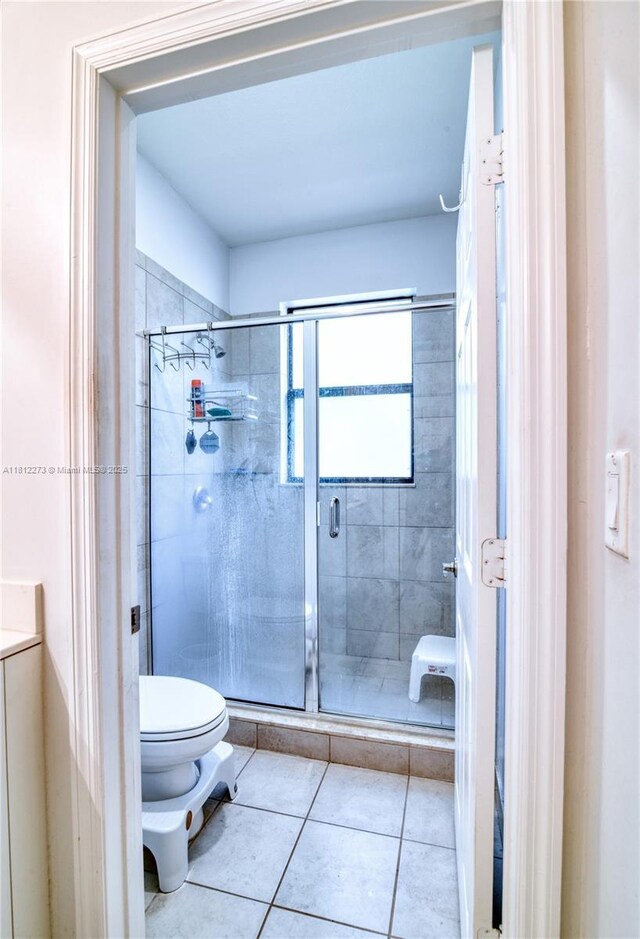6489 N Anise Ct, Davie, FL 33314 - full bathroom featuring toilet, a stall shower, and tile patterned floors