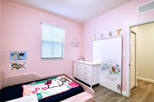 6489 N Anise Ct, Davie, FL 33314 - bedroom with light wood-style flooring and baseboards