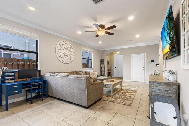 3401 SE 5th St, Homestead, FL 33033 - living area with arched walkways, a ceiling fan, light tile patterned flooring, ornamental molding, and recessed lighting