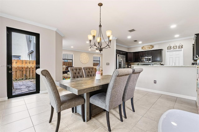 3401 SE 5th St, Homestead, FL 33033 - dining room with a chandelier, crown molding, light tile patterned floors, recessed lighting, and baseboards