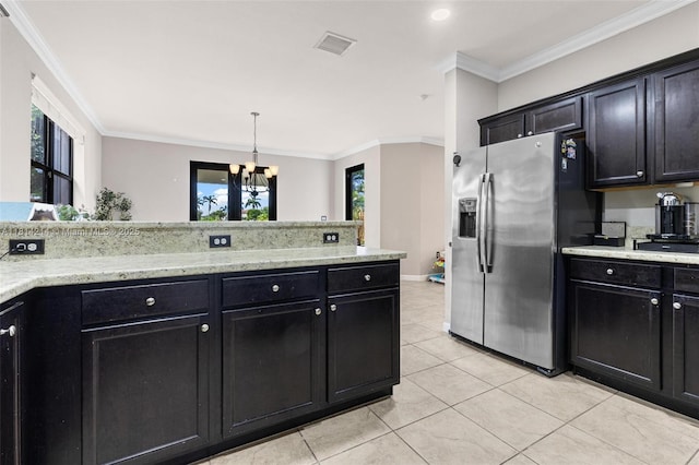 3401 SE 5th St, Homestead, FL 33033 - kitchen with stainless steel fridge, a chandelier, dark cabinets, light tile patterned floors, and crown molding