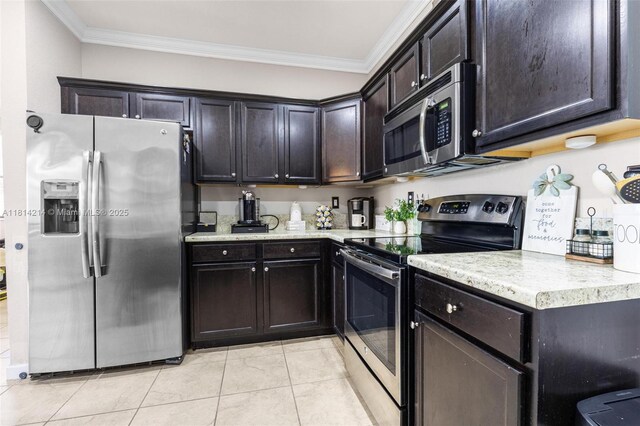 3401 SE 5th St, Homestead, FL 33033 - kitchen featuring appliances with stainless steel finishes, crown molding, light countertops, light tile patterned floors, and dark brown cabinetry