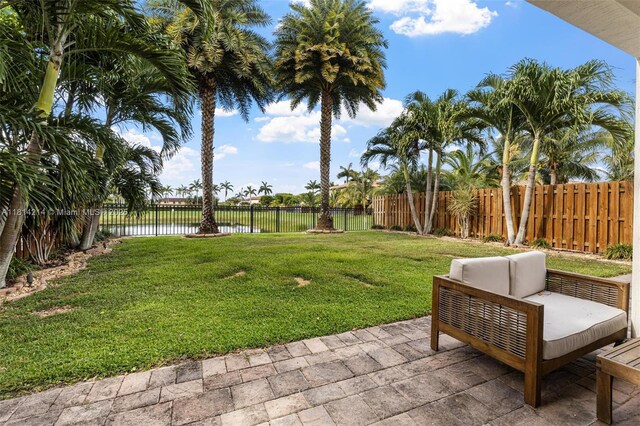 3401 SE 5th St, Homestead, FL 33033 - view of yard featuring a water view, a patio area, and outdoor lounge area