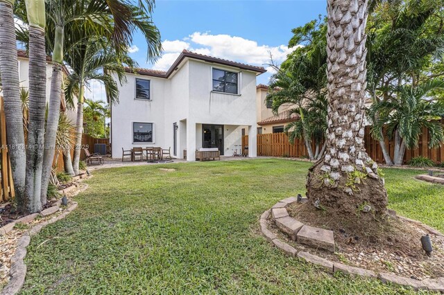 3401 SE 5th St, Homestead, FL 33033 - rear view of property featuring stucco siding, a tile roof, a patio, and central air condition unit