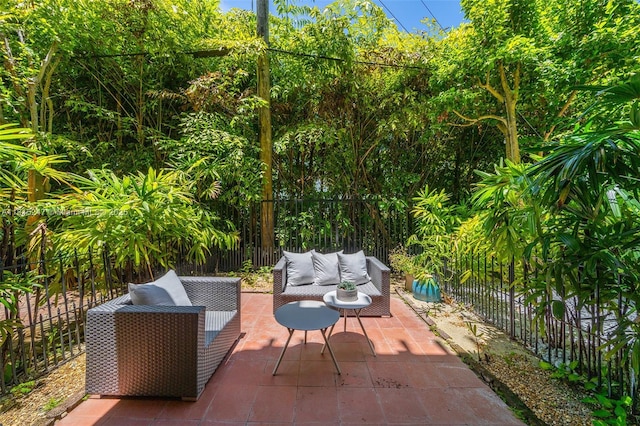 615 Santander Ave Unit C, Coral Gables, FL 33134 - fenced backyard featuring outdoor lounge area and a patio
