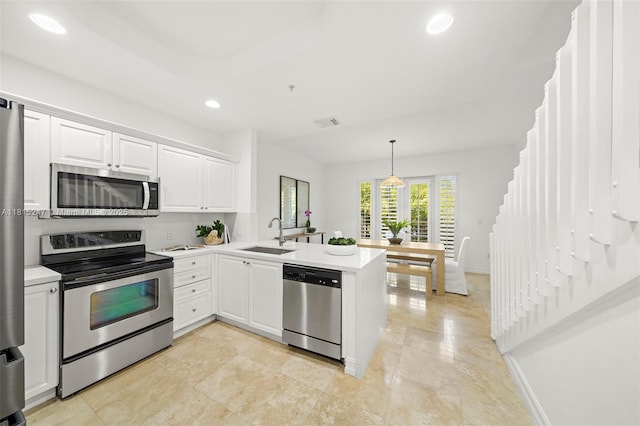 615 Santander Ave Unit C, Coral Gables, FL 33134 - kitchen with appliances with stainless steel finishes, a sink, light countertops, a peninsula, and recessed lighting