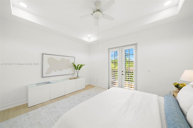 615 Santander Ave Unit C, Coral Gables, FL 33134 - bedroom with a raised ceiling, access to outside, wood finished floors, recessed lighting, and baseboards