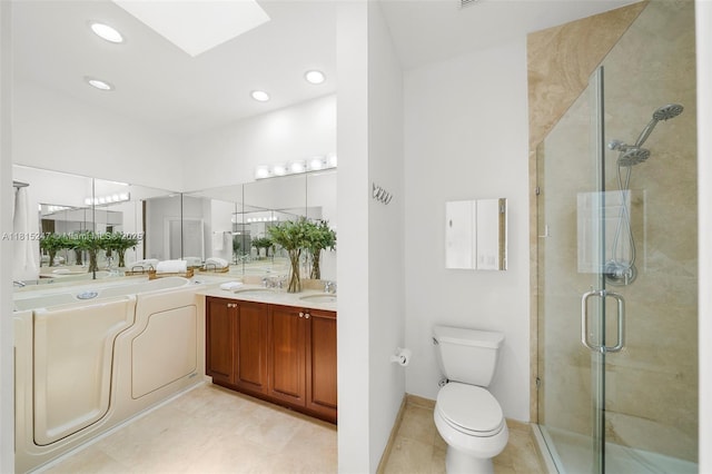 615 Santander Ave Unit C, Coral Gables, FL 33134 - full bathroom featuring a stall shower, double vanity, a skylight, toilet, and recessed lighting
