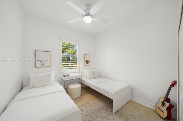 615 Santander Ave Unit C, Coral Gables, FL 33134 - bedroom featuring light wood-type flooring, baseboards, and a ceiling fan