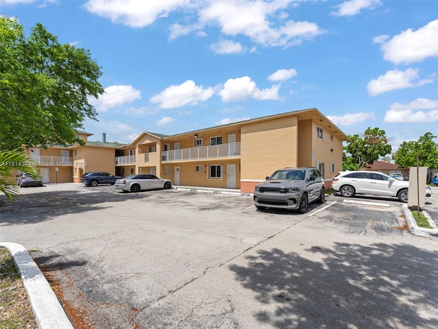 7905 W 30th Ct Unit 204, Hialeah, FL 33018 - uncovered parking lot featuring a residential view