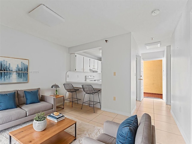 7905 W 30th Ct Unit 204, Hialeah, FL 33018 - living area featuring light tile patterned floors and baseboards