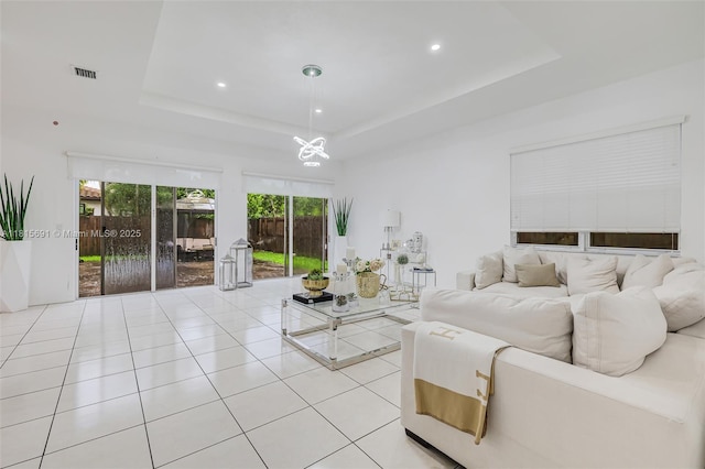 15104 SW 176th St, Miami, FL 33187 - living room with a raised ceiling, a chandelier, light tile patterned floors, healthy amount of natural light, and recessed lighting